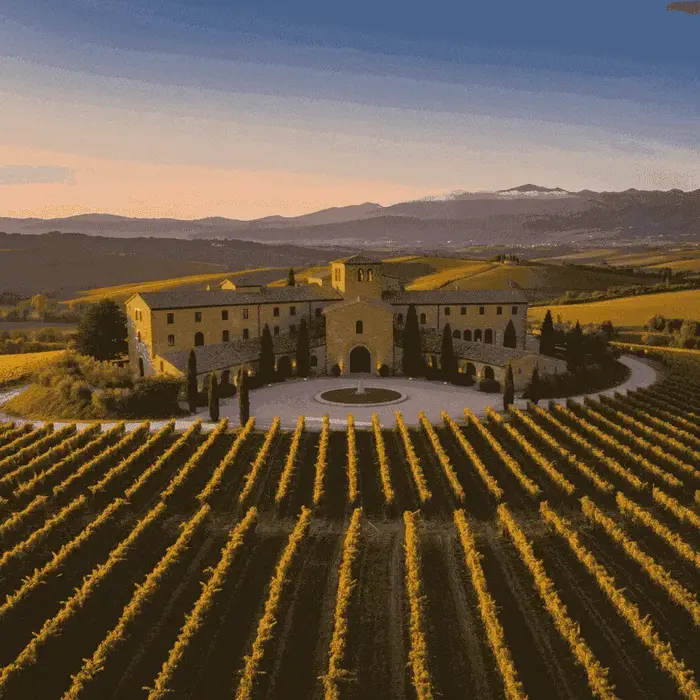 Historic Italian winery with rows of grapevines